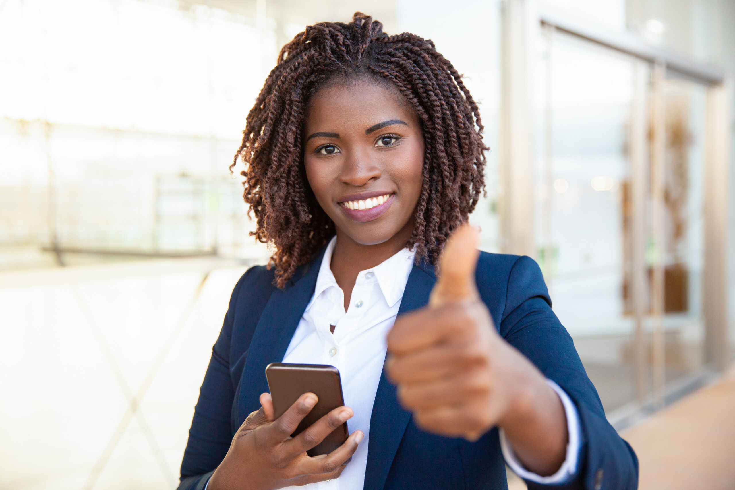 happy-satisfied-female-customer-holding-cellphone-scaled