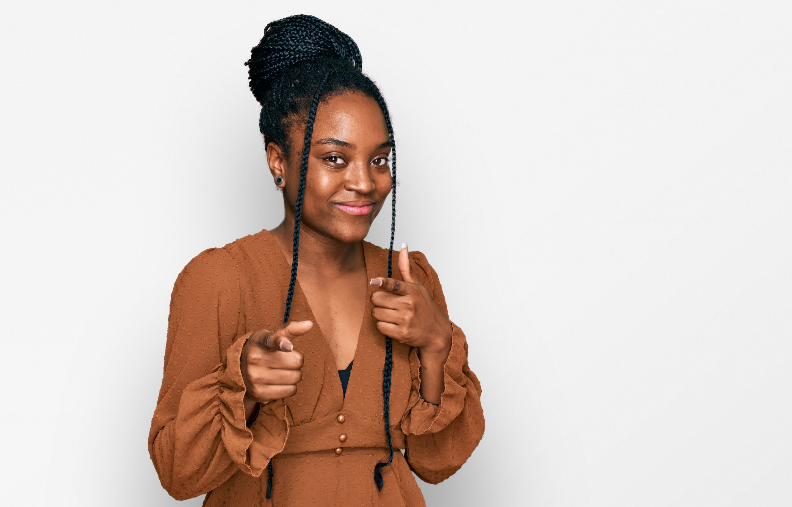 young-african-american-woman-wearing-casual-clothes-pointing-fingers-camera-with-happy-funny-face-good-energy-vibes-scaled